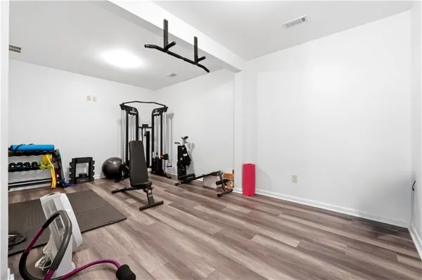 a living room with furniture and a ceiling fan