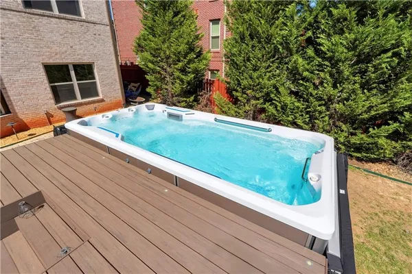 an aerial view of a house with garden space and a street view