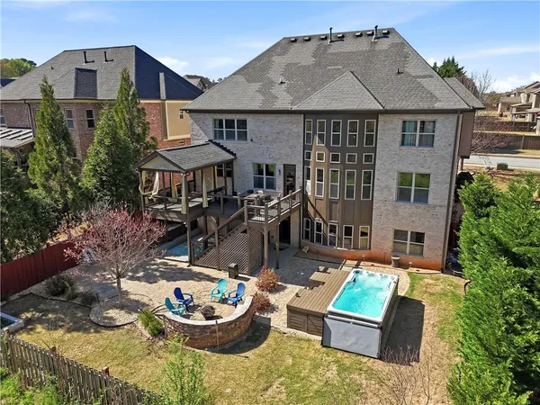 an aerial view of a house with a big yard