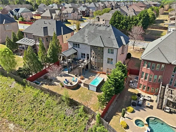 aerial view of a house with a lake view