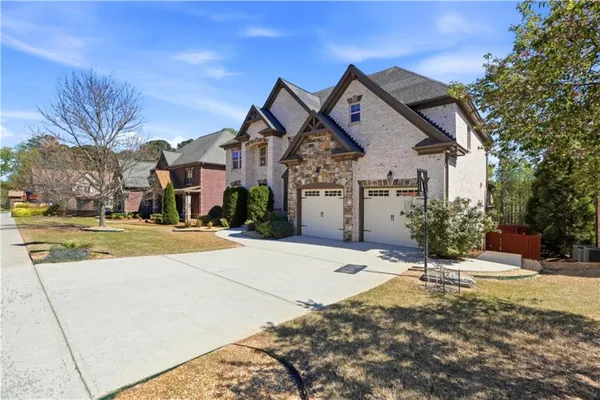 a front view of a house with a yard