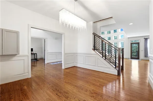 a view of an entryway with wooden floor