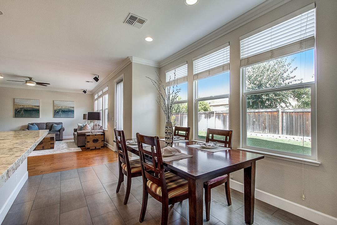7108 Lahinch Drive Gilroy, CA 95020 - Photo 17 of 50 a view of a dining room with furniture and wooden floor