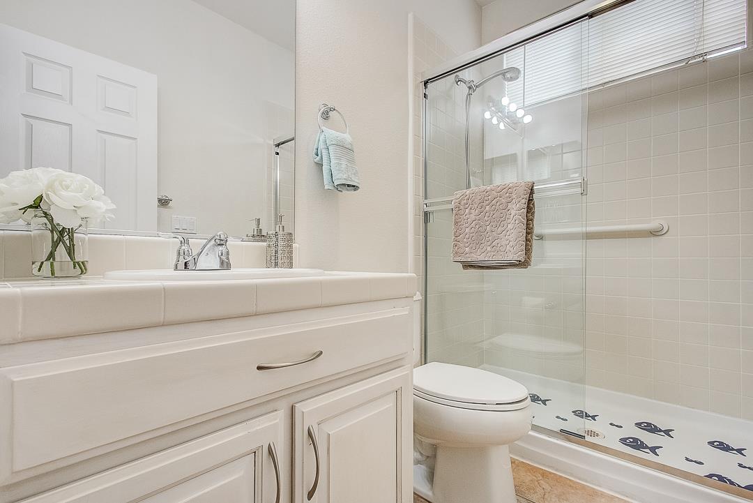 7108 Lahinch Drive Gilroy, CA 95020 - Photo 21 of 50 a bathroom with a sink a toilet and shower
