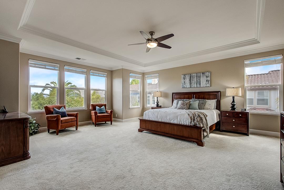 7108 Lahinch Drive Gilroy, CA 95020 - Photo 29 of 50 a spacious bedroom with a bed and a couch