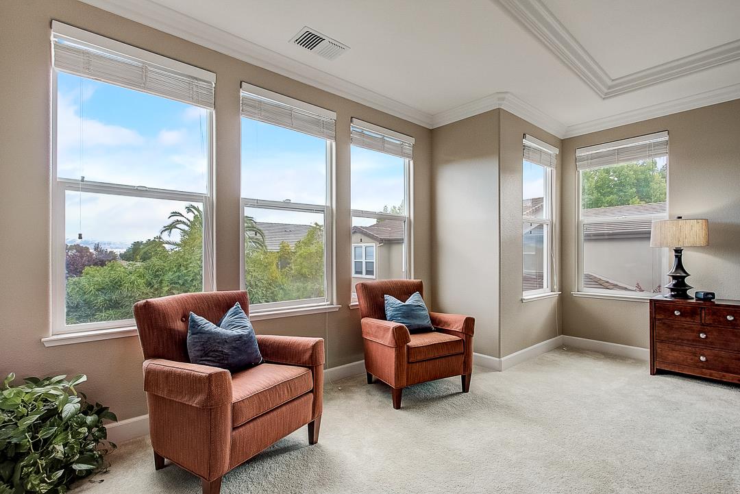 7108 Lahinch Drive Gilroy, CA 95020 - Photo 30 of 50 a living room with furniture and a floor to ceiling window