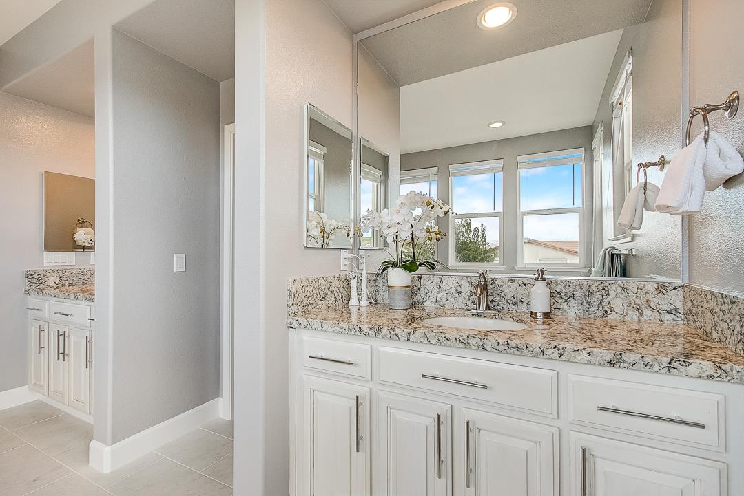 7108 Lahinch Drive Gilroy, CA 95020 - Photo 33 of 50 a bathroom with a sink and a mirror