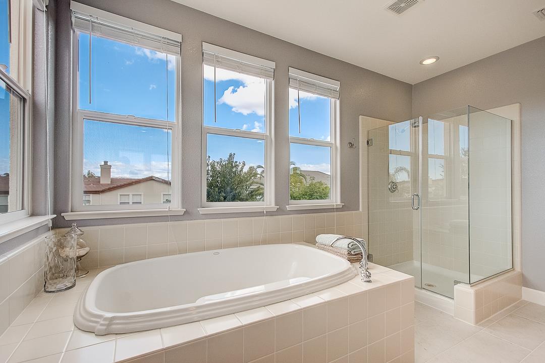 7108 Lahinch Drive Gilroy, CA 95020 - Photo 34 of 50 a white bath tub sitting next to a shower