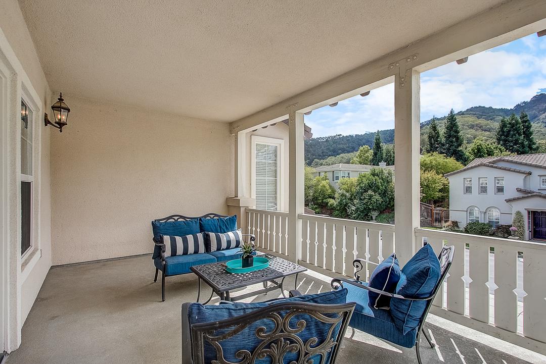 7108 Lahinch Drive Gilroy, CA 95020 - Photo 38 of 50 a living room with furniture and a floor to ceiling window