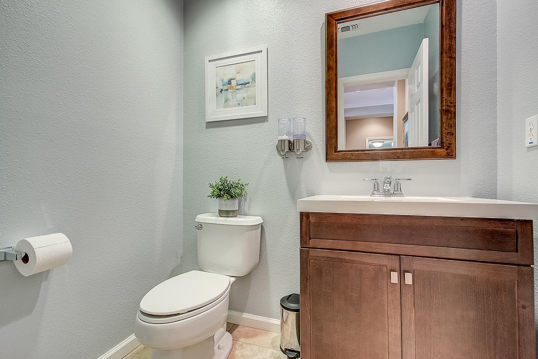 7108 Lahinch Drive Gilroy, CA 95020 - Photo 40 of 50 a bathroom with a toilet sink and mirror