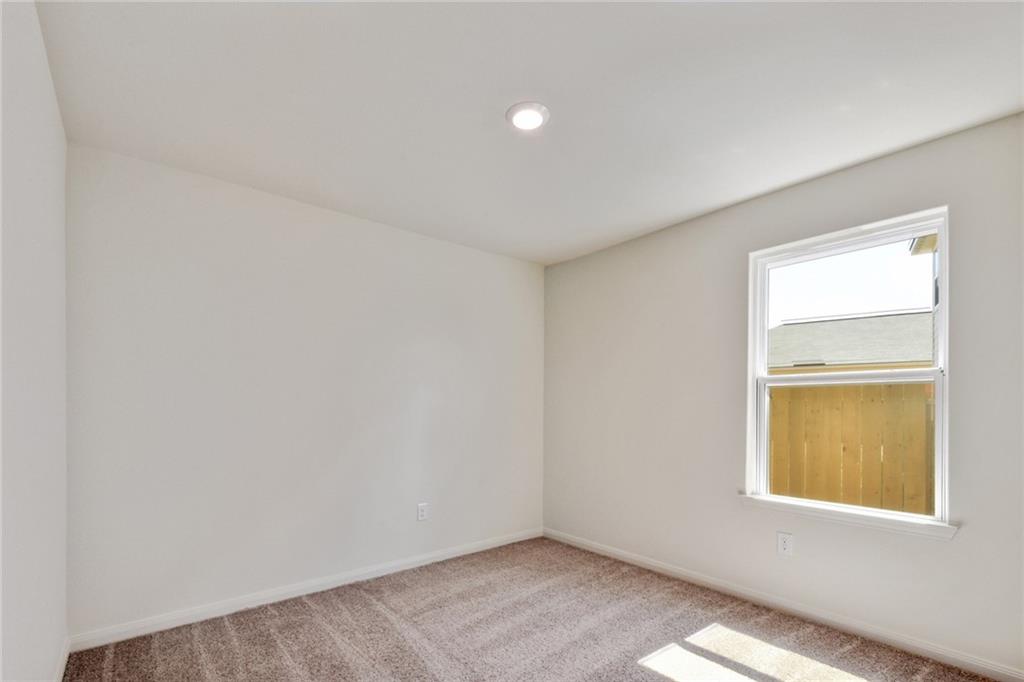 140 Allington Circle Jarrell, TX 76537 - Photo 8 of 23 Spare room featuring light colored carpet and recessed lighting