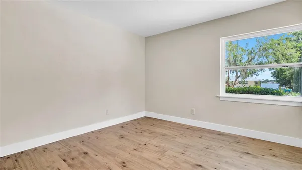 a white bath tub sitting next to a white toilet