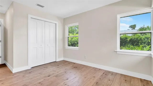 a view of wooden floor in an empty room