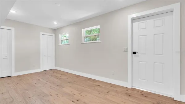 a kitchen with stainless steel appliances refrigerator and microwave