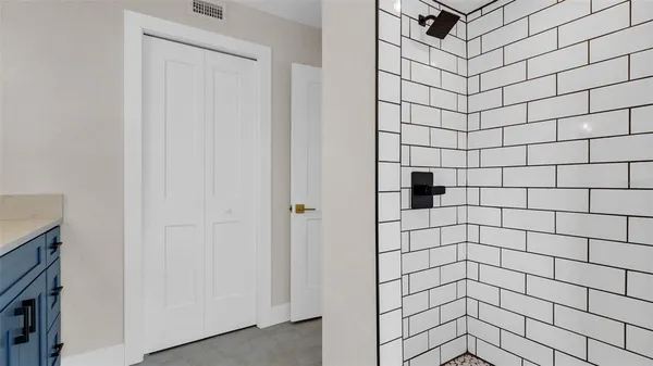 an empty room with windows and entrance