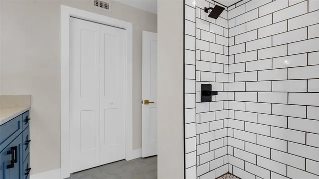 an empty room with windows and entrance