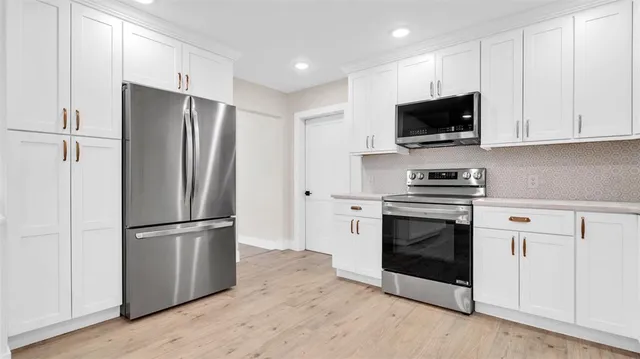 an aerial view of a houses with a lake view