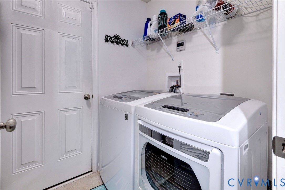 8428 Sheldon Branch Place Toano, VA 23168 - Photo 18 of 46 a utility room with dryer and washer