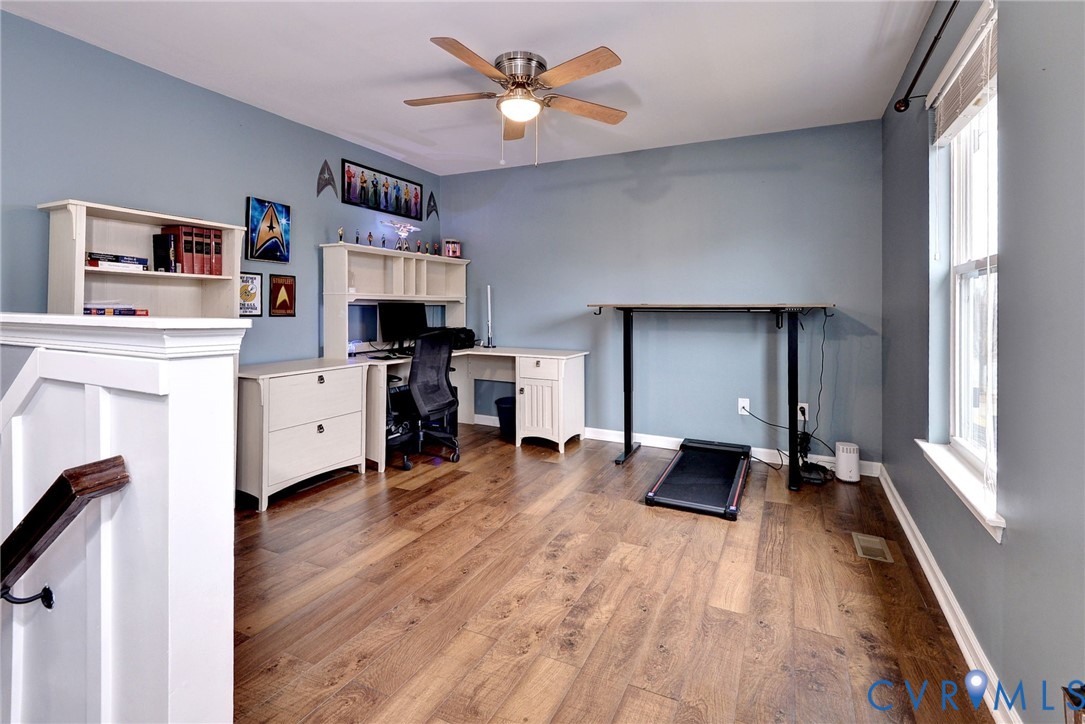 8428 Sheldon Branch Place Toano, VA 23168 - Photo 19 of 46 a living room with furniture and a fireplace
