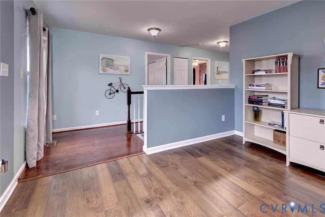 8428 Sheldon Branch Place Toano, VA 23168 - Photo 20 of 46 a view of a livingroom with furniture and an empty room