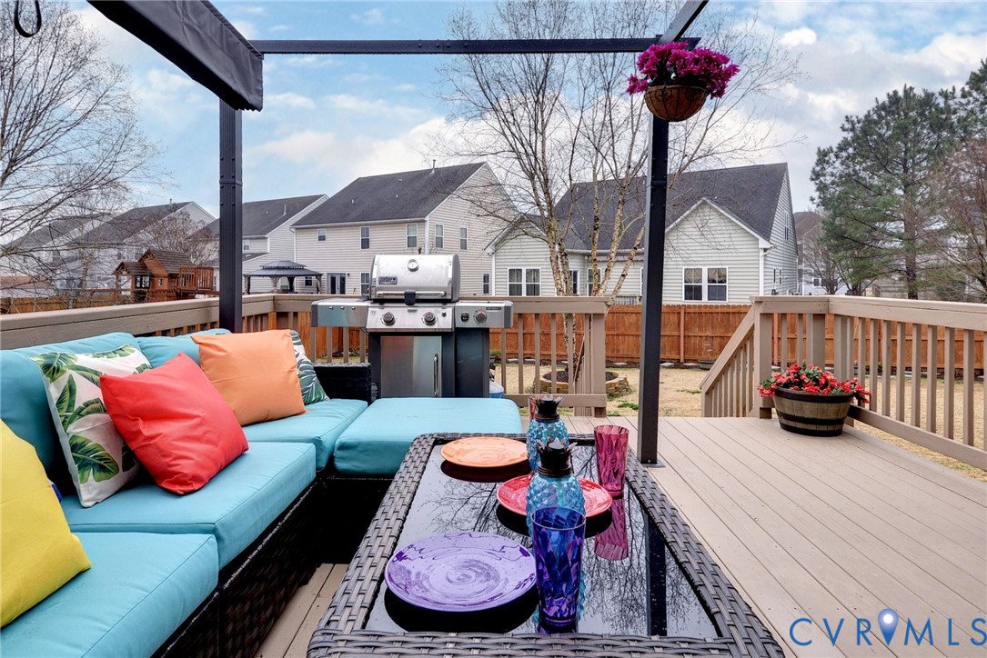 8428 Sheldon Branch Place Toano, VA 23168 - Photo 29 of 46 a view of a patio with couches table and chairs and a barbeque