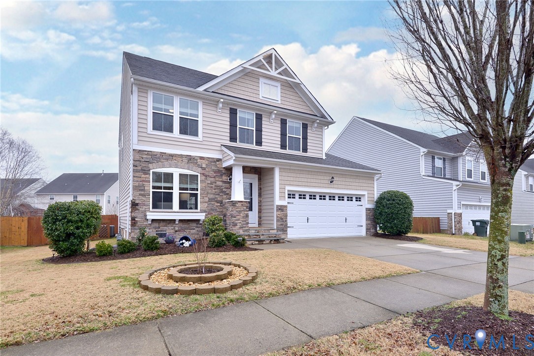 8428 Sheldon Branch Place Toano, VA 23168 - Photo 34 of 46 a front view of a house with a yard