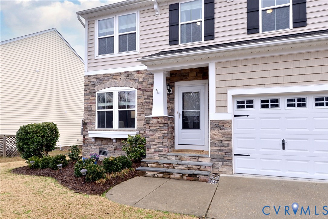 8428 Sheldon Branch Place Toano, VA 23168 - Photo 35 of 46 a front view of a building with a yard