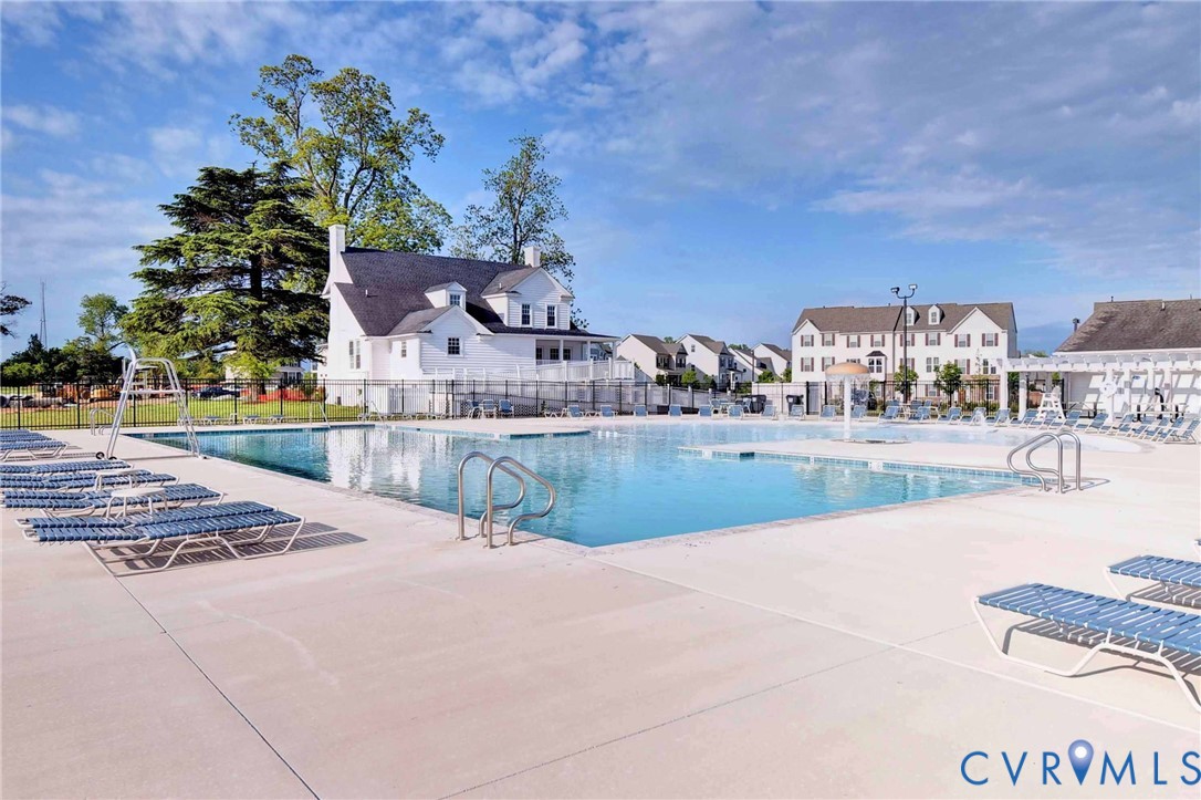 8428 Sheldon Branch Place Toano, VA 23168 - Photo 44 of 46 a view of a swimming pool and a yard