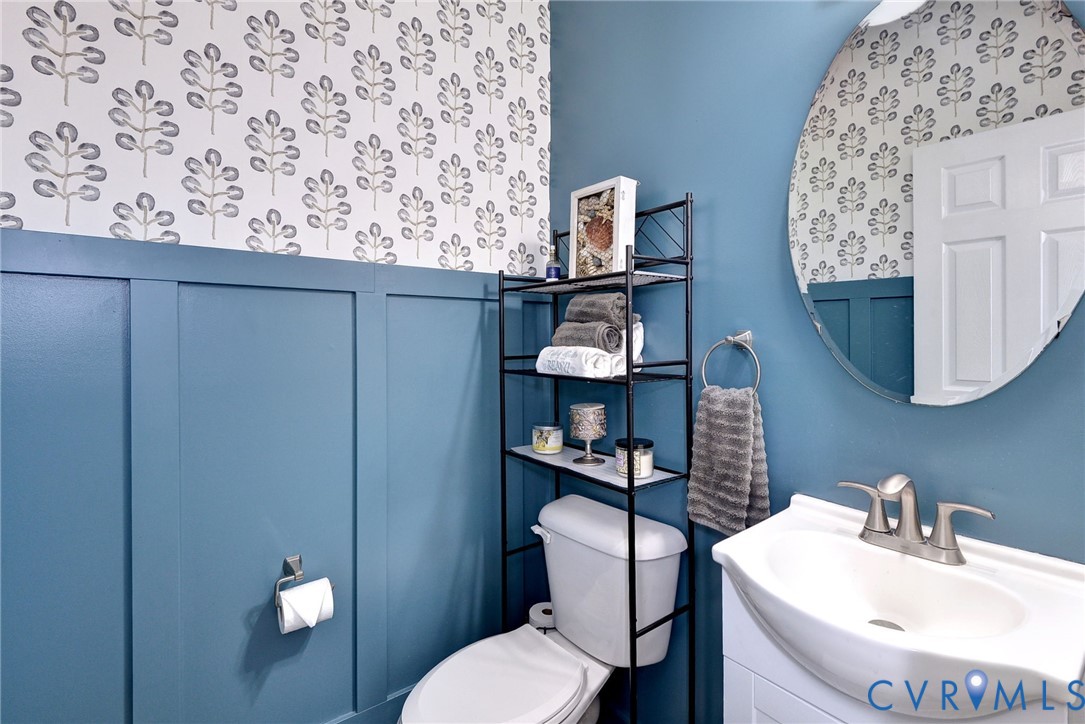 8428 Sheldon Branch Place Toano, VA 23168 - Photo 5 of 46 a bathroom with a toilet sink and mirror