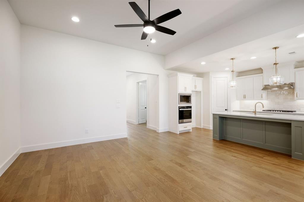 4314 Haley Way Oak Point, TX 75068 - Photo 5 of 28 Open-concept living space featuring wood-finish flooring, recessed lighting, and a modern ceiling fan