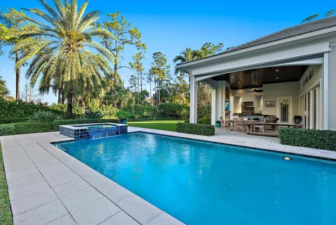 a view of a dining room with furniture wooden floor and windows