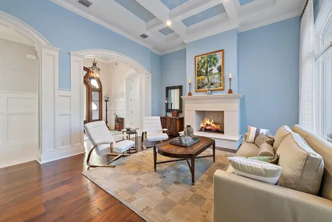 a view of living room with furniture and large windows