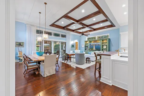 a bathroom with a sink and mirror with bathtub