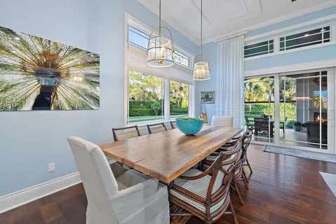 a spacious bathroom with a double vanity sink a large mirror and a shower
