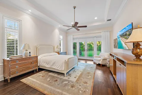 a bed room with furniture and painting on the wall