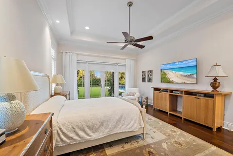 an aerial view of a house with a swimming pool outdoor seating and yard