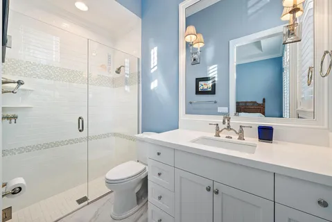 an aerial view of residential houses with outdoor space and street view