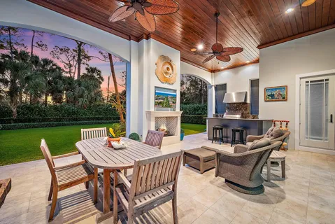 a view of a patio with a yard table and chairs