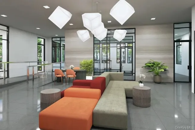 a living room with furniture potted plant and a large mirror