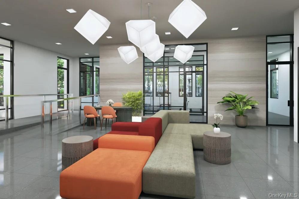 15 Parkview Avenue, Unit 307 Bronxville, NY 10708 - Photo 5 of 7 a living room with furniture potted plant and a large mirror