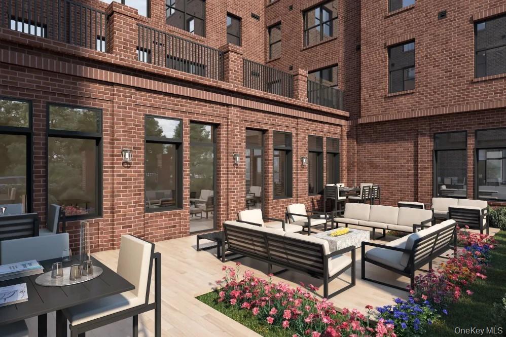 15 Parkview Avenue, Unit 307 Bronxville, NY 10708 - Photo 7 of 7 a view of a patio with couches table and chairs and potted plants