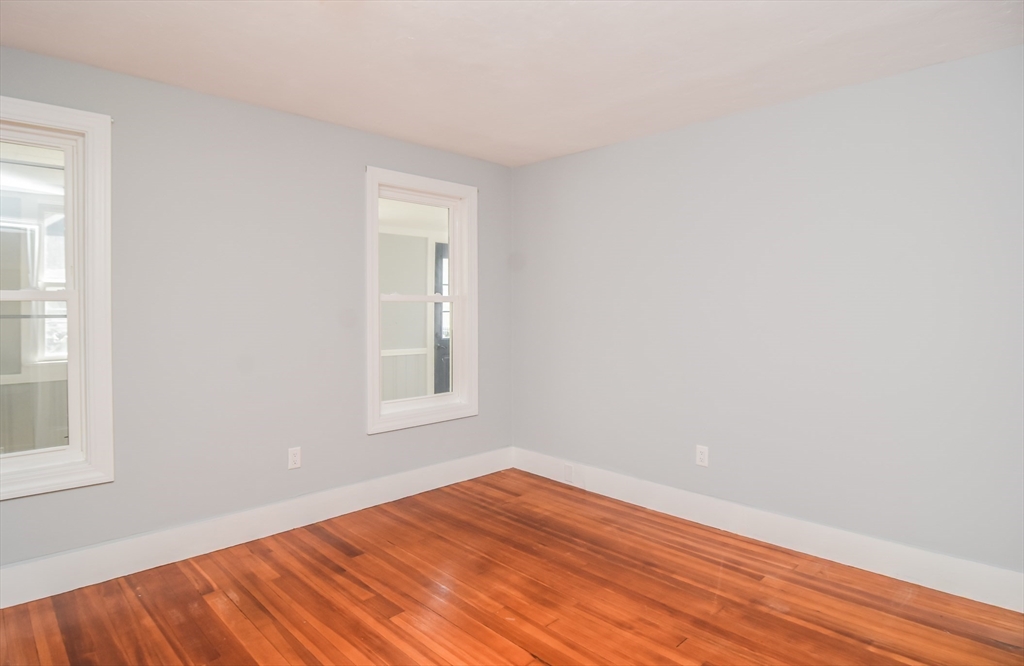 13 Crump Street Hudson, MA 01749 - Photo 13 of 33 an empty room with wooden floor and windows