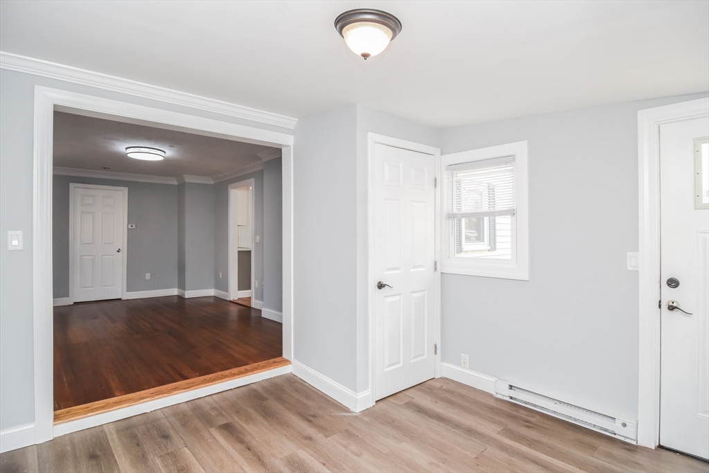 13 Crump Street Hudson, MA 01749 - Photo 14 of 33 an empty room with wooden floor and windows