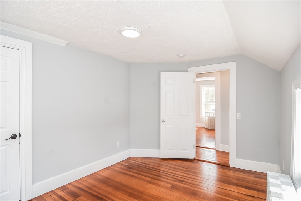 13 Crump Street Hudson, MA 01749 - Photo 19 of 33 a view of wooden floor and windows in a room