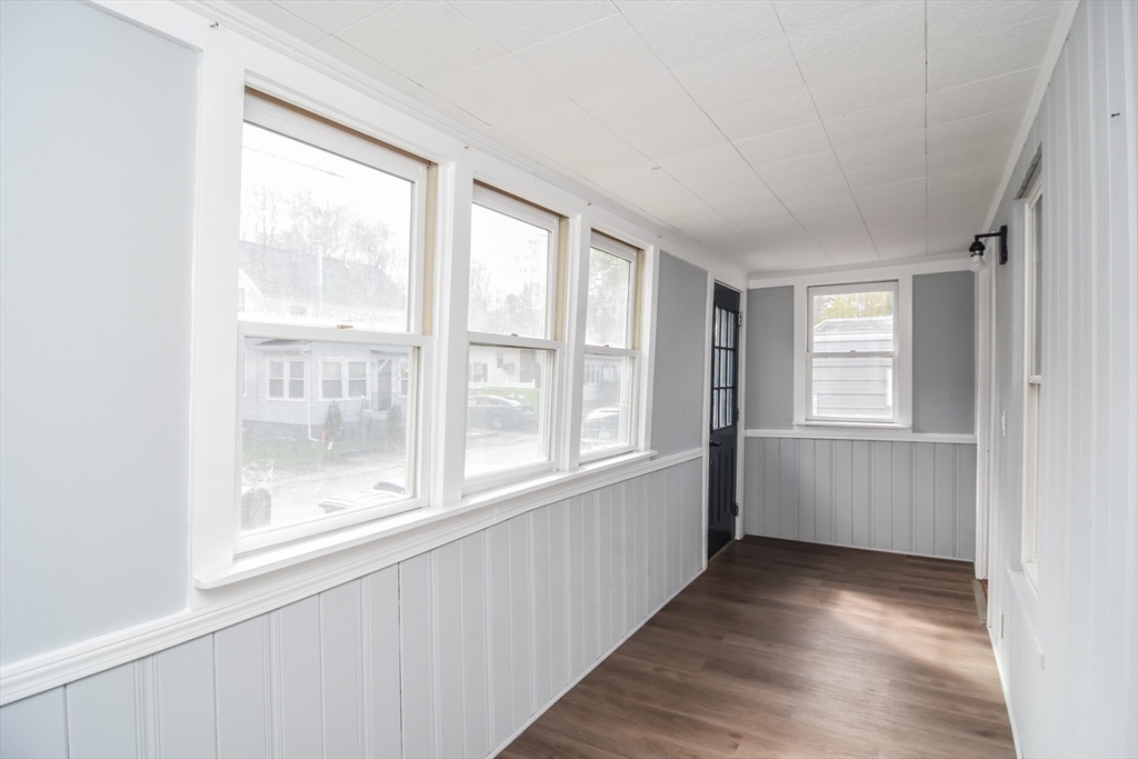 13 Crump Street Hudson, MA 01749 - Photo 25 of 33 a view of an empty room with wooden floor and a window
