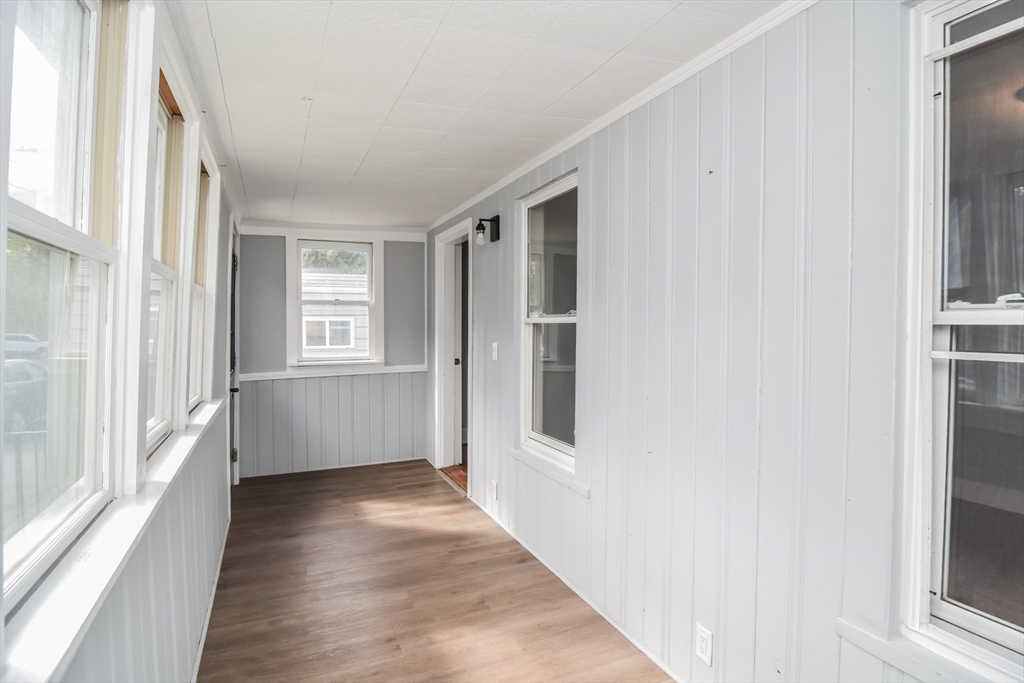 13 Crump Street Hudson, MA 01749 - Photo 26 of 33 a view of an empty room with wooden floor and a window