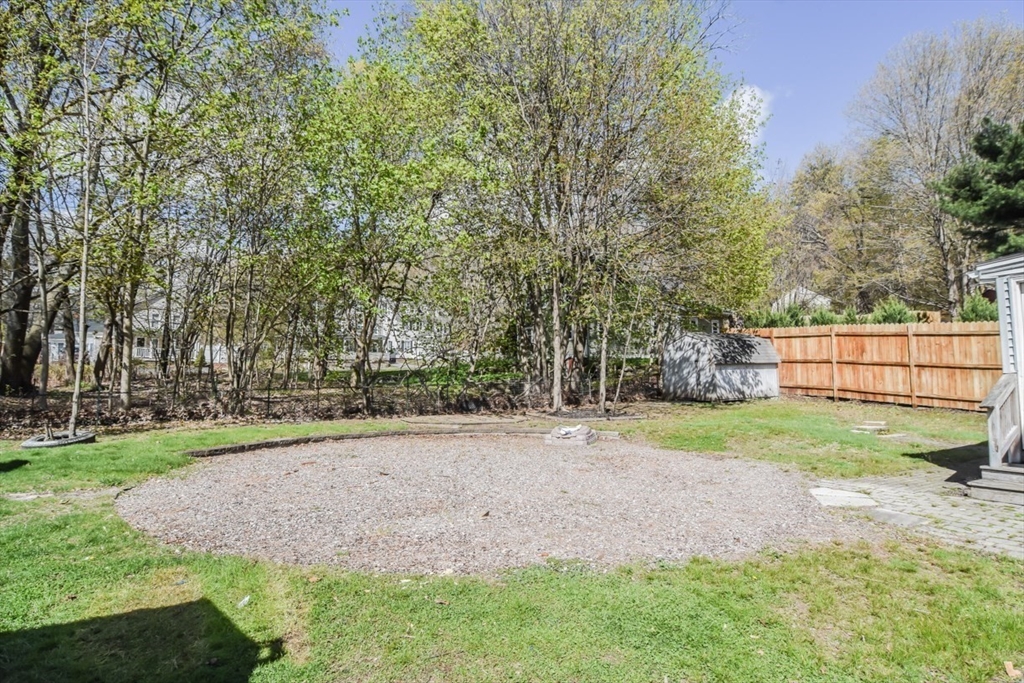 13 Crump Street Hudson, MA 01749 - Photo 32 of 33 a view of a backyard with large trees