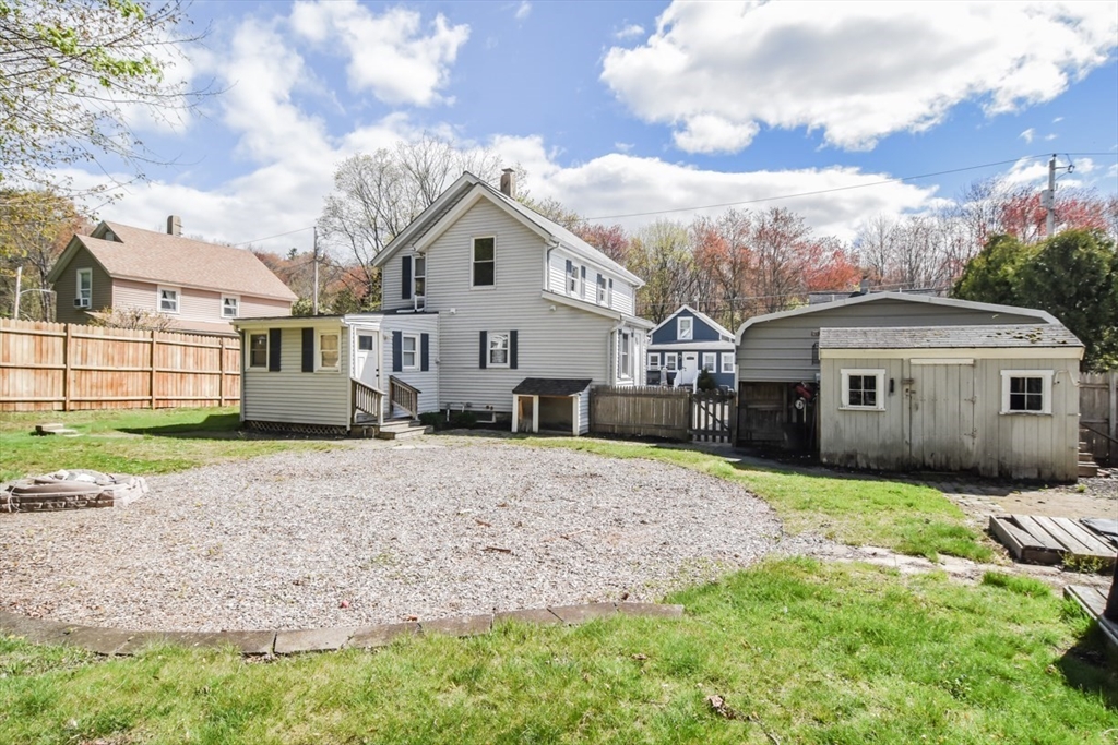 13 Crump Street Hudson, MA 01749 - Photo 33 of 33 a front view of a house with a yard and garage