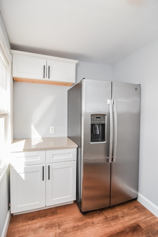 13 Crump Street Hudson, MA 01749 - Photo 6 of 33 a kitchen with cabinets and stainless steel appliances