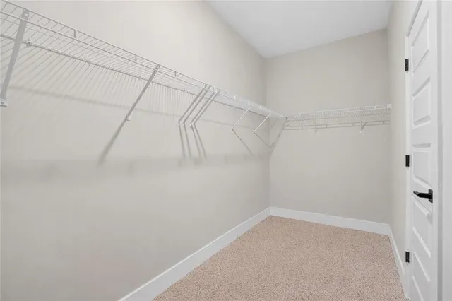 an empty room with closet area